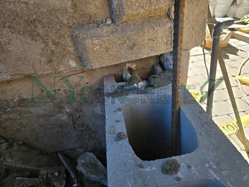 water pressure behind a failing concrete retaining wall